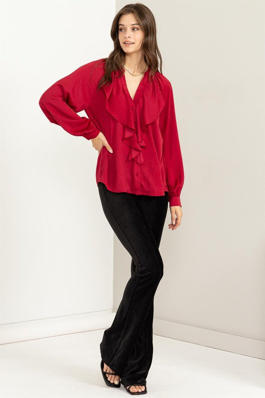 Blusa con volantes manga larga