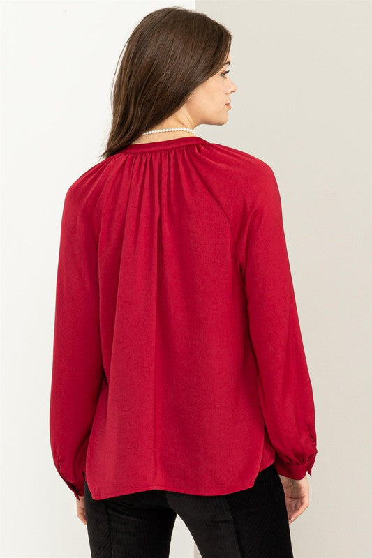 Blusa con volantes manga larga