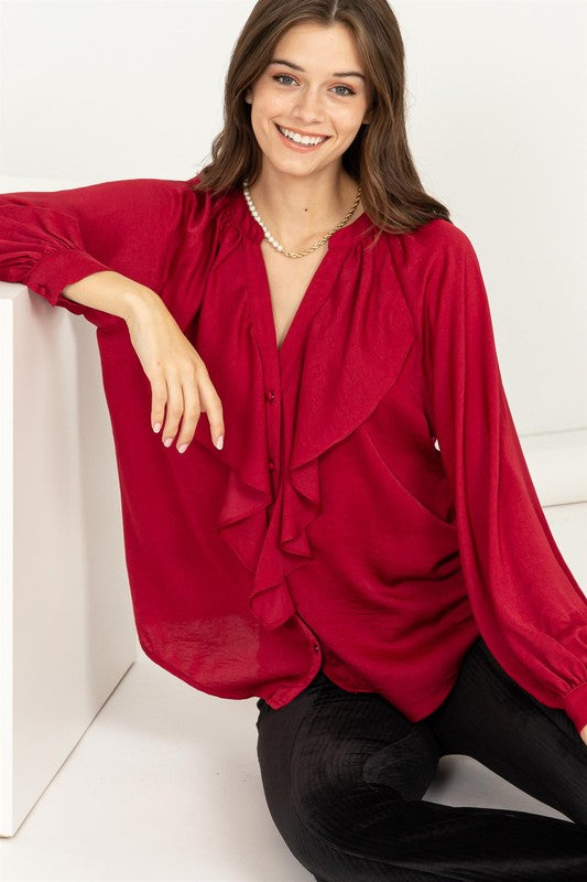 Blusa con volantes manga larga