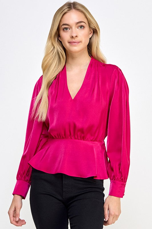 Top peplum de manga larga