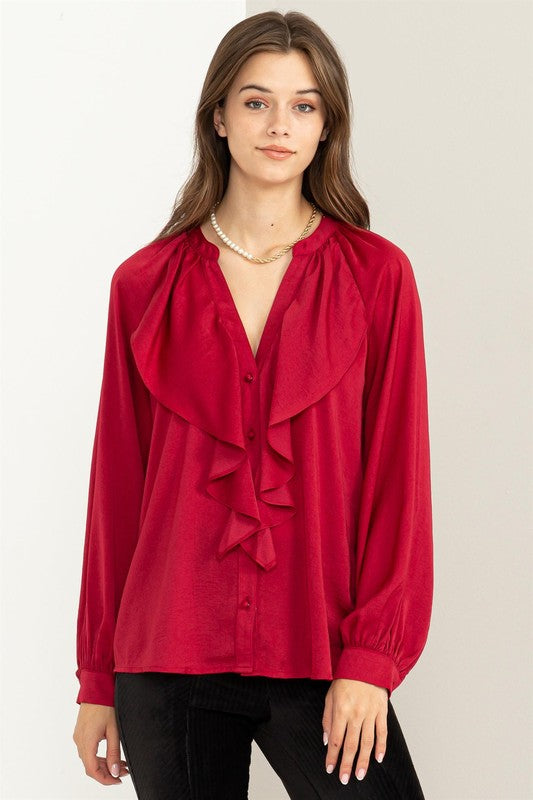 Blusa con volantes manga larga