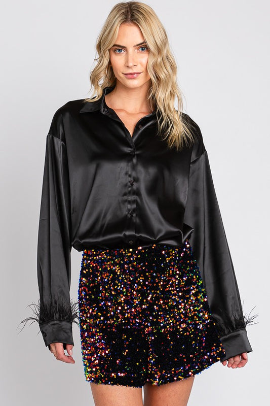 Camisa oversized con plumas en las mangas