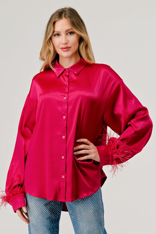 Camisa oversized con plumas en las mangas